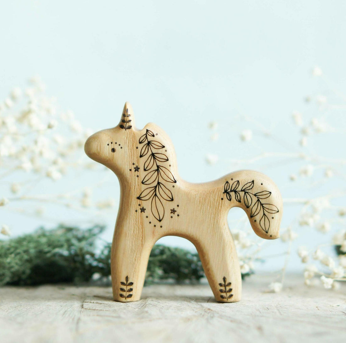 Wooden Baby Unicorn, Looking Up, a natural wood animal toy by Tiny Fox Hole, cut and finished by hand from solid wood