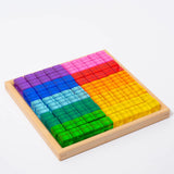 Bauspiel Lucent Cubes in their wooden tray, sorted into blocks of purple, pink, blue, green and yellow · view 3