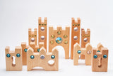 Bauspiel Small Fairytale Castle pieces arranged into a wide castle with towers, gates and keyhole walls · view 3