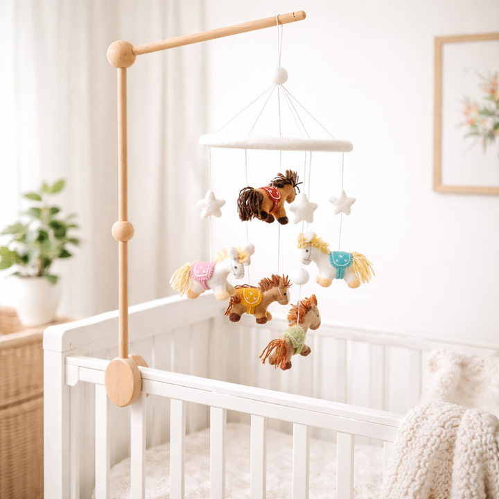 Handmade felt baby mobile with colorful carousel ponies