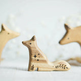 Wooden Baby Wolf, Sitting, a natural wood animal toy by Tiny Fox Hole, cut and finished by hand from solid wood · view 1