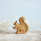Wooden Squirrel with Flowers, a natural wood animal toy by Tiny Fox Hole, cut and finished by hand from solid wood · view 1