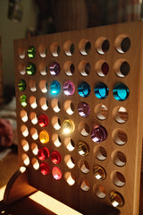 Bauspiel game board with glowing lucent cylinders in rainbow colors · view 5
