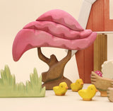 Third view of the wooden cherry tree showing the trunk and base · view 3