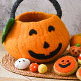 Felt jack-o-lantern bag with the play food packed inside it · view 3