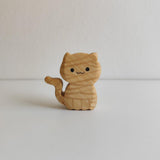 Juharka wooden mummy cat wrapped in carved bandages with one paw raised · view 1