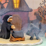 Second view of the wooden witch house set showing the fence and pumpkins in front of the house · view 3